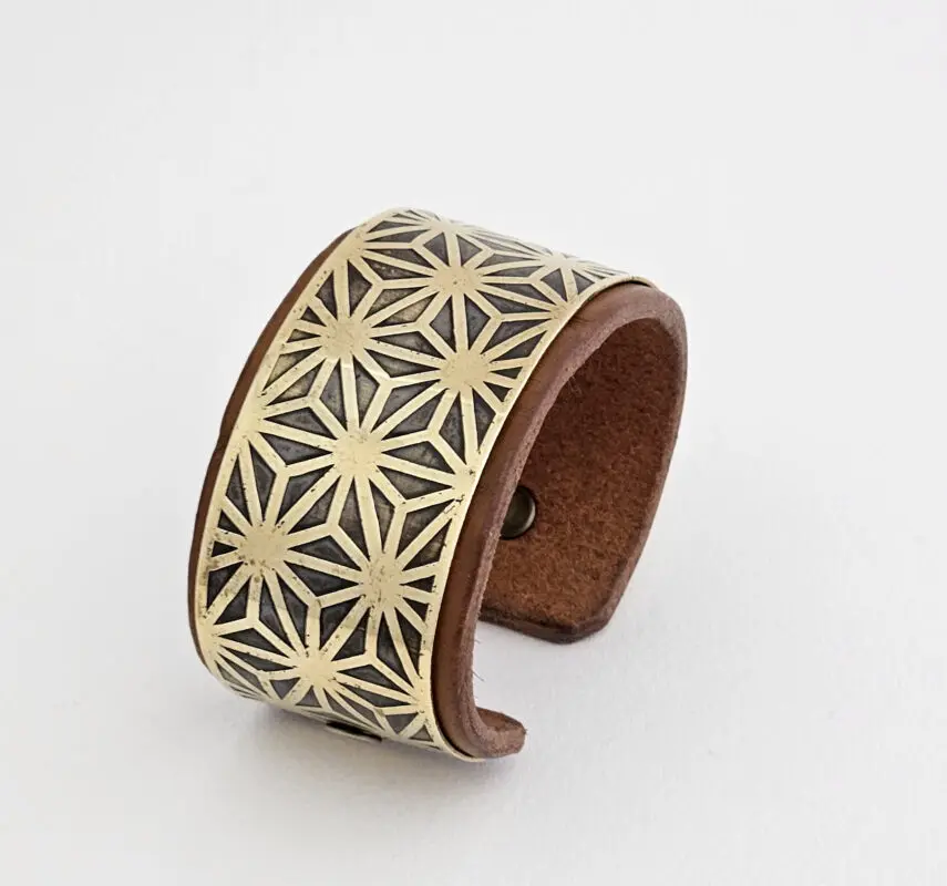 Handcrafted brass and leather bracelet featuring the Asanoha pattern